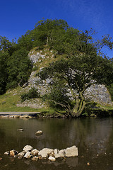 Image showing View of a rocky hill with river in foreground