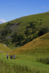 Image showing Group of people walking in hills