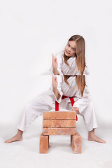 Image showing Karate girl breaks bricks 1