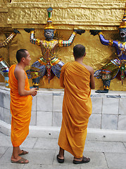 Image showing Monks inspect statues at the Grand Palace, Bangkok, Thailand - E