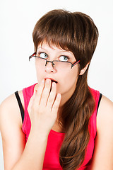 Image showing Young attractive girl with glasses surprised