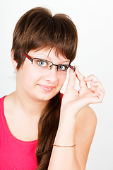 Image showing Young attractive blue-eyed girl in glasses