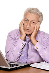 Image showing Elderly businessman with laptop