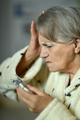 Image showing Senior  woman with pills