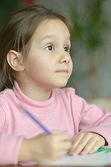 Image showing Little girl draws