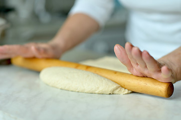 Image showing Woman making dough