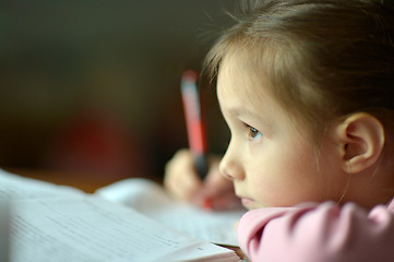 Image showing Little girl writing