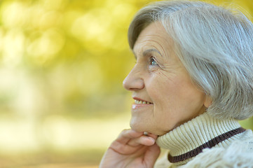 Image showing Thoughtful senior woman in autumn