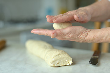 Image showing Woman making dough