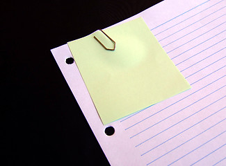 Image showing Clipped yellow paper on lined paper background