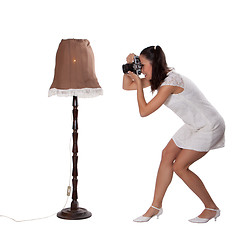 Image showing Retro woman with an old camera