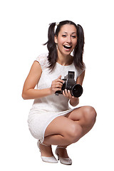 Image showing Retro woman with an old camera