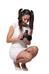 Image showing Retro woman with an old camera