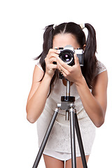 Image showing Retro woman with an old camera