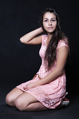 Image showing Young woman in pink mini dress