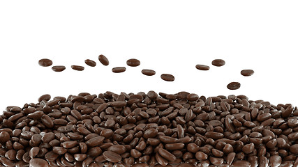 Image showing Tossed roasted coffee beans isolated