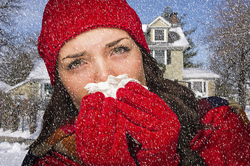 Image showing Sick Woman In Snow Blowing Her Sore Nose With Tissue