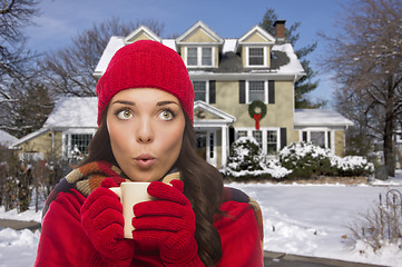 Image showing Woman in Winter Clothing Holding Mug Outside in Snow