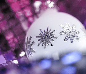 Image showing white Christmas bauble with metallic ornaments