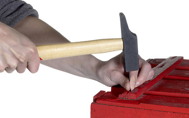 Image showing hammering a red wooden box