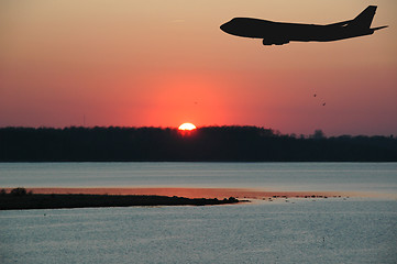 Image showing Sunset and plane