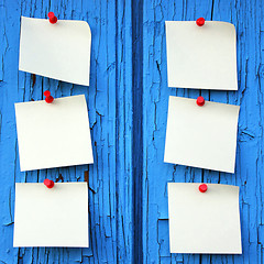 Image showing reminder notes, blue wood background with space for your message