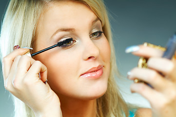 Image showing Girl doing makeup