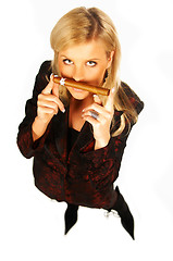 Image showing Blonde girl holding cigar
