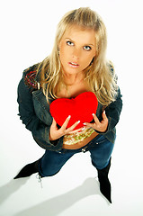 Image showing girl holding a red velvet heart