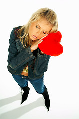 Image showing girl holding a red velvet heart