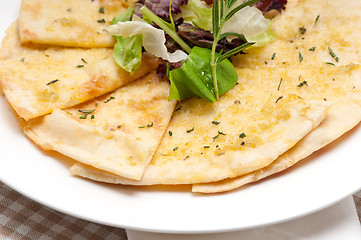 Image showing garlic pita bread pizza with salad on top