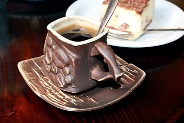 Image showing cup of coffee and portion of cake