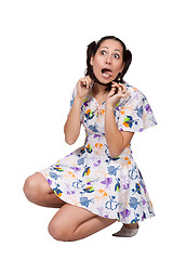 Image showing A girl with pigtails in colorful retro dress