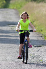 Image showing Teens girl on bike