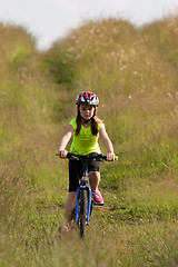 Image showing Teens girl on bike