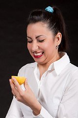 Image showing woman eat yellow lemon