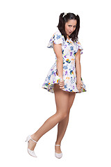Image showing A girl with pigtails in colorful retro dress