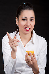 Image showing woman eat yellow lemon