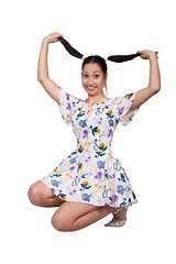 Image showing A girl with pigtails in colorful retro dress