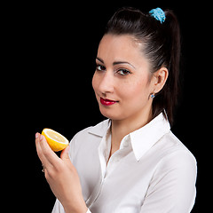 Image showing woman eat yellow lemon