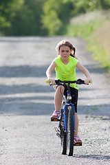 Image showing Teens girl on bike