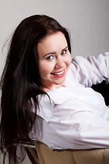 Image showing Portrait of long-haired woman in a white men's shirt