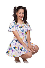 Image showing A girl with pigtails in colorful retro dress