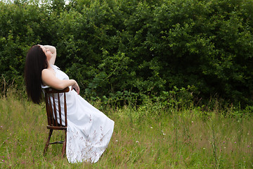 Image showing Woman on old chair