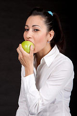 Image showing woman eat green apple