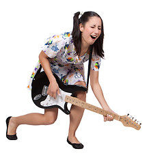 Image showing A girl with pigtails in colorful retro dress