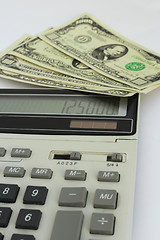 Image showing dollar bank notes and calculator