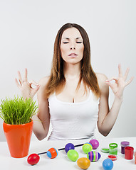 Image showing Relaxed girl and painted eggs