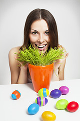 Image showing Girl and painted eggs