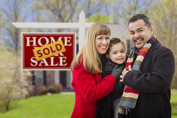 Image showing Family in Front of Sold Real Estate Sign and House